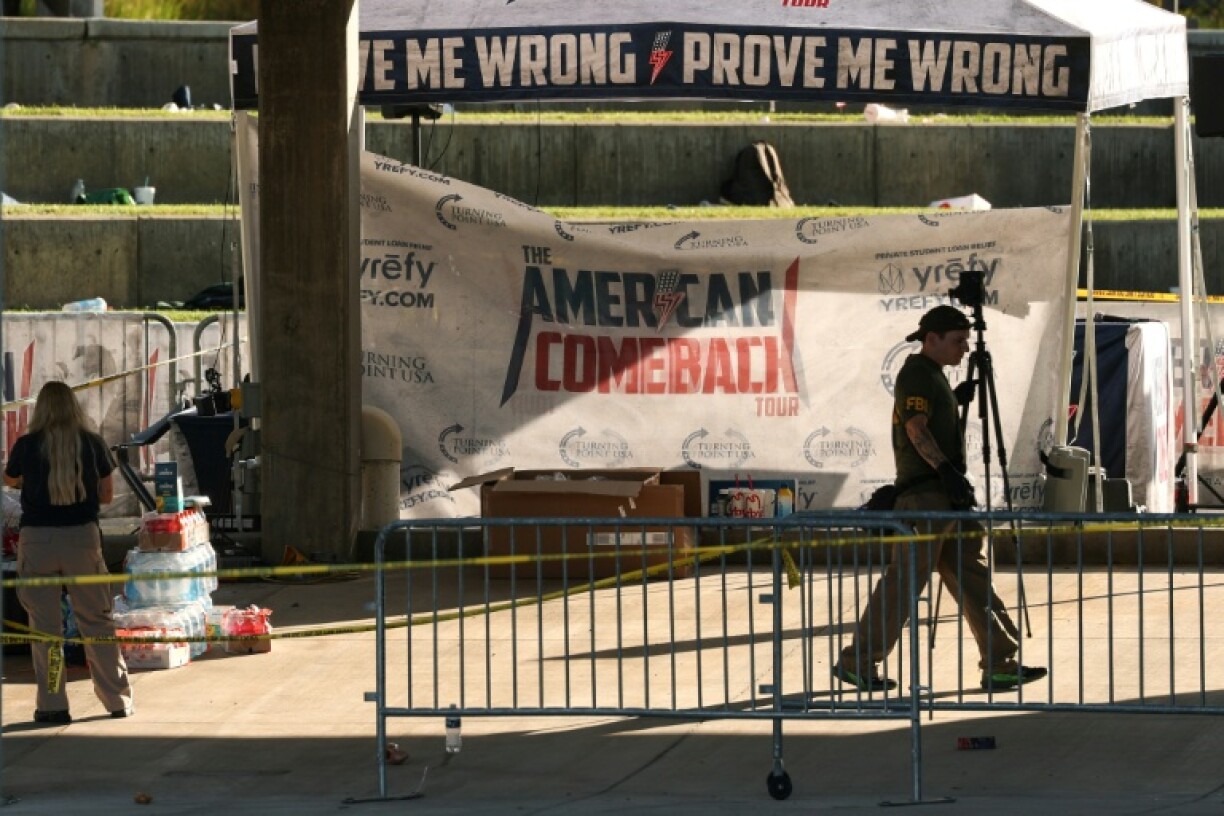 Law enforcement agents work at the scene where political activist Charlie Kirk was shot and killed at Utah Valley University in Orem, Utah,
