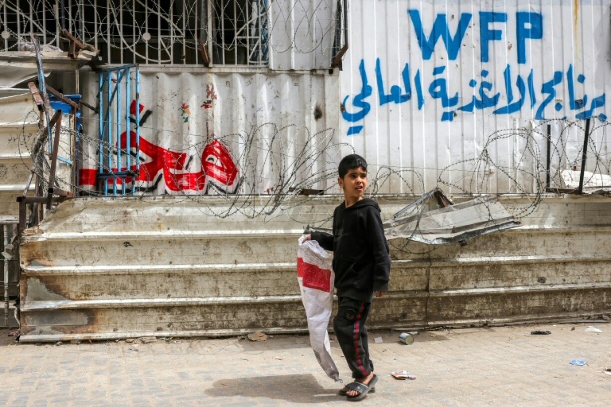 A Palestinian boy leaves empty-handed after finding this Gaza City bakery closed for want of flour after stocks ran out in the face of a month-old Israeli aid blockade.