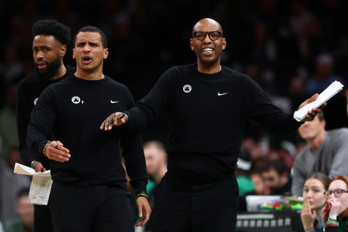 Boston Celtics head coach Joe Mazzulla, left, is held back by assistant coach Sam Cassell after being issued a technical foul in Boston's loss to Chicago, a game after which Mazzulla was fined $35,000 for pursuing an official and bad language
