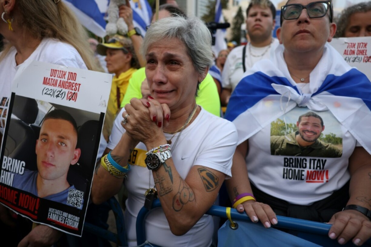 The crowd applauded when the hostage releases were announced