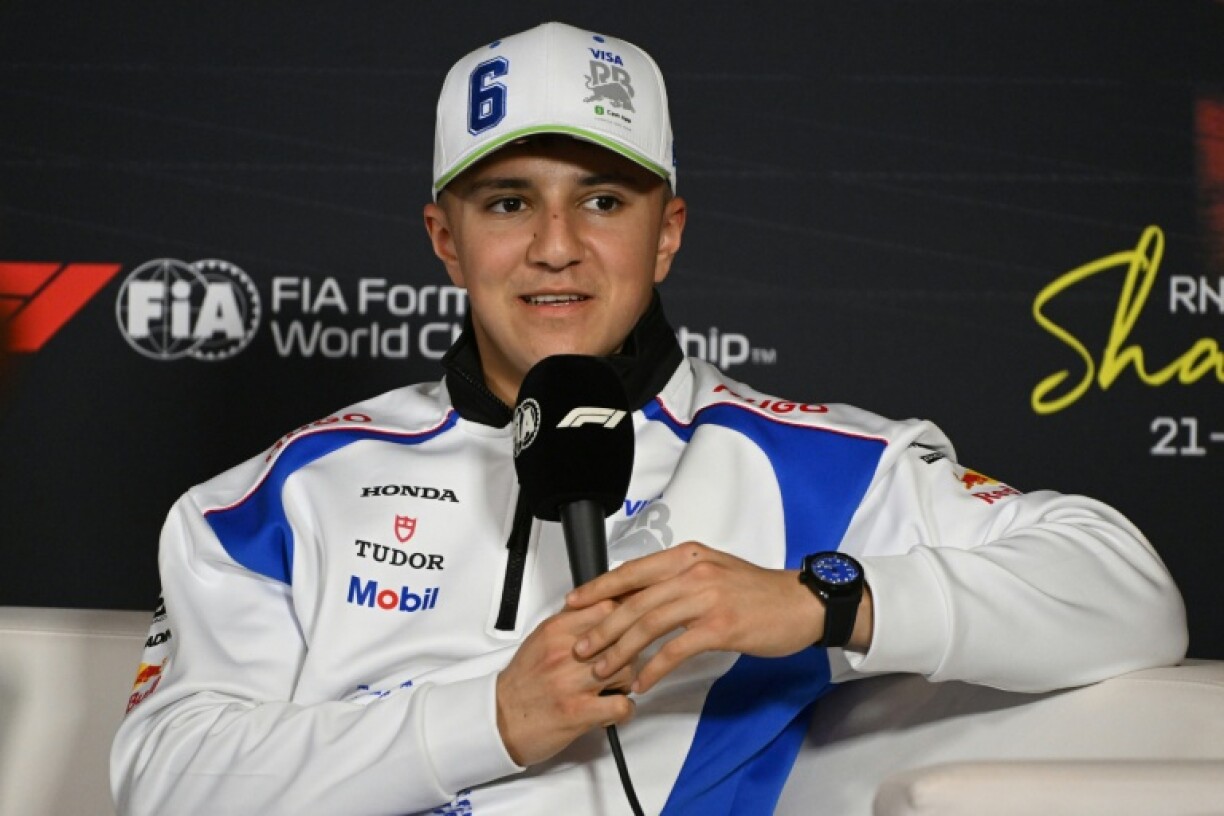 RB's French driver Isack Hadjar talks to reporters in Shanghai