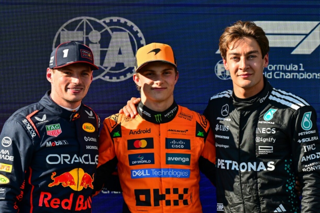 (From L) Second-placed Red Bull Racing's Max Verstappen, first-placed McLaren's Oscar Piastri and third-placed Mercedes' George Russell after qualifying for the Emilia Romagna Formula One Grand Prix at Imola