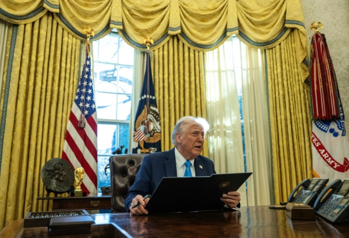 US President Donald Trump speaks to the press as he signs executive orders in the Oval Office of the White House on February 4, 2025