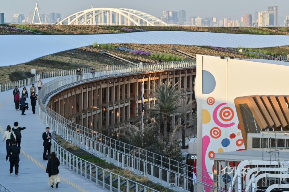 Visitors walk around the