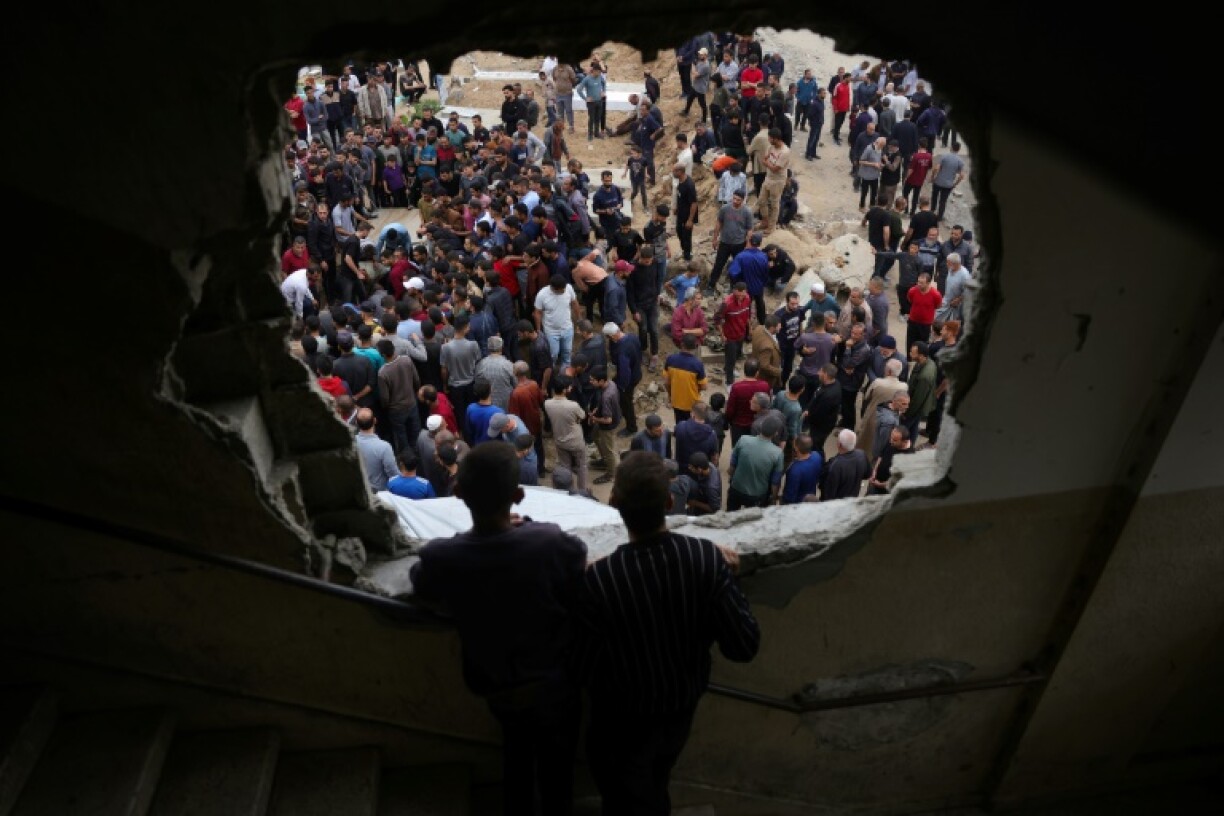 Palestinians bury relatives killed in overnight Israeli strikes in northern Gaza