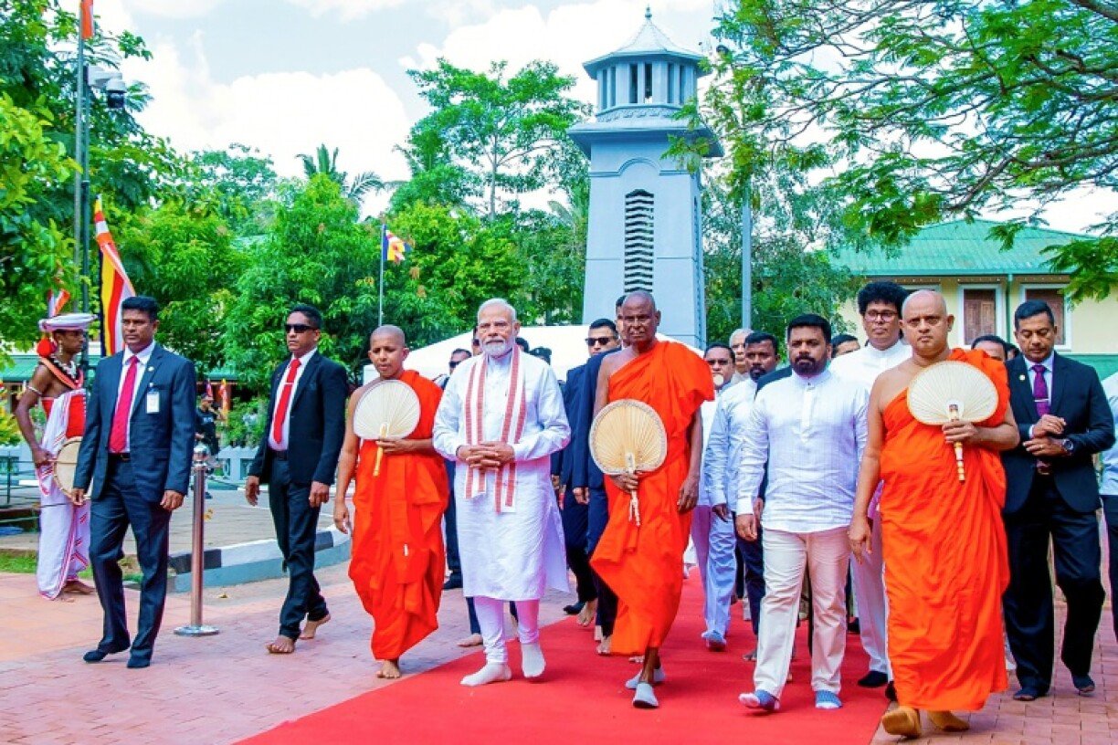 Sri Lankan President Anura Kumara Dissanayake (4R) and India's Prime Minister Narendra Modi (4L) visited the Sri Maha Bodhi temple in Anuradhapura