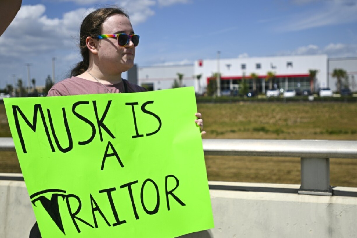Demonstrators denounce Tesla CEO Elon Musk in Clermont, Florida, part of a day of protest against the tech billionaire on March 29, 2025