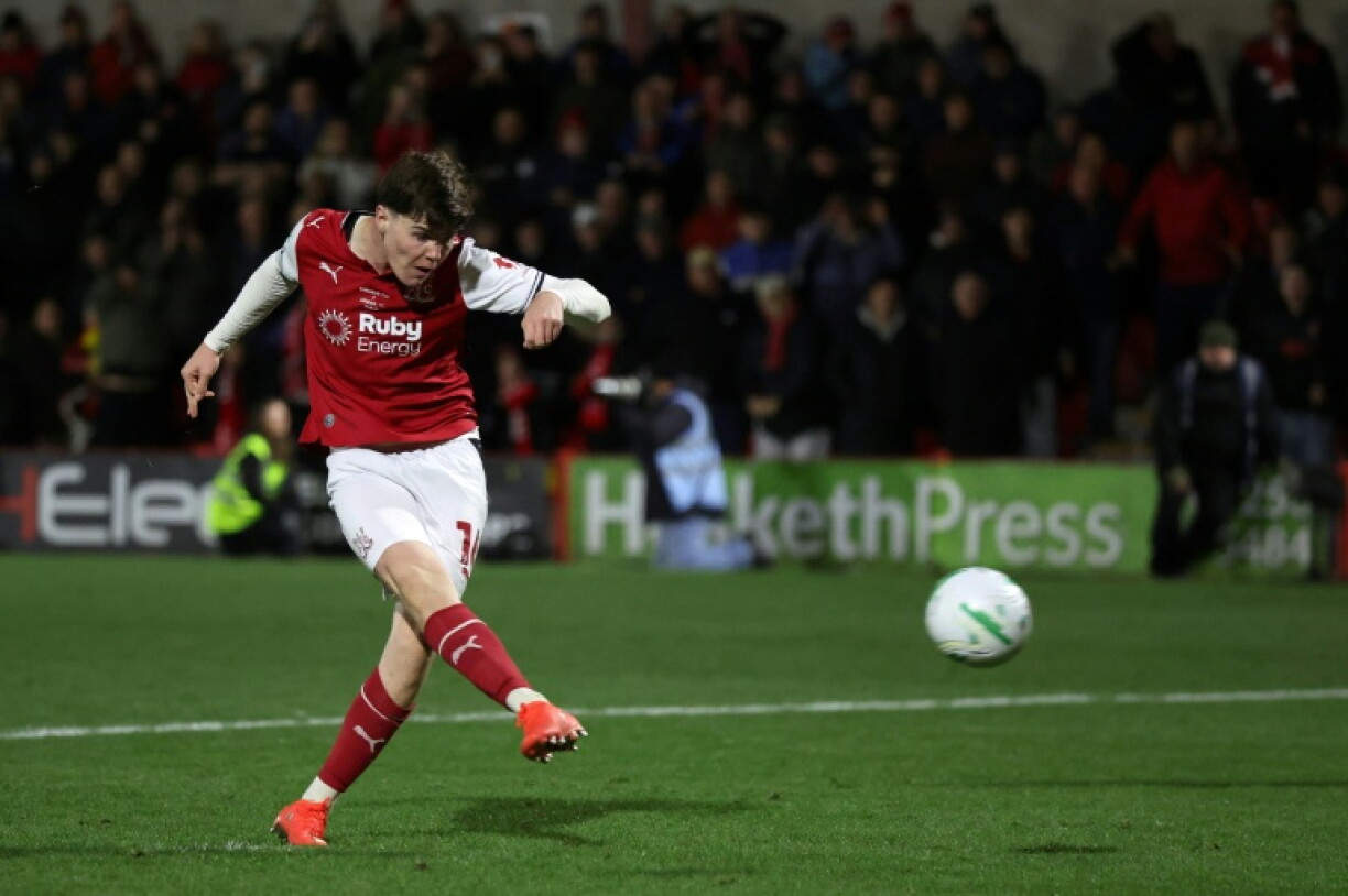 Conor Haughey scores the winning penalty as Fleetwood Town defeat Arsenal in a shootout following a 1-1 draw in an English League Cup fourth-round tie at Highbury Stadium, Fleetwood