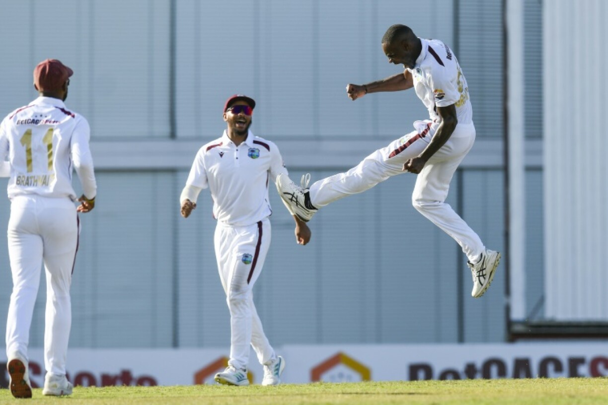 Justin Greaves (R) and Brandon King (L) of West Indies celebrate the dismissal of Cameron Green of Australia on the second day of the 1st Test match at Kensington Oval, Bridgetown, Barbados