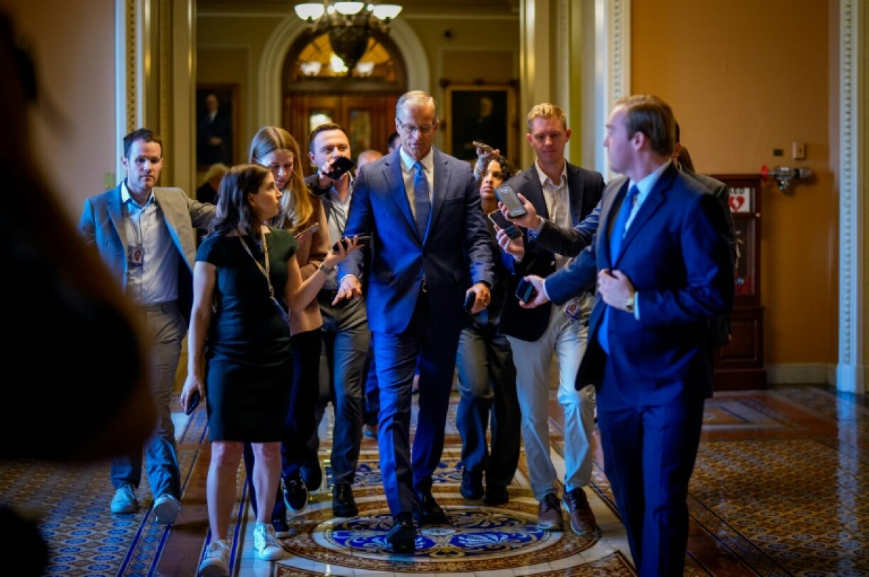 US Senate Majority Leader John Thune speaks to reporters as returns to his office from the Senate Chamber at the U.S. Capitol Building