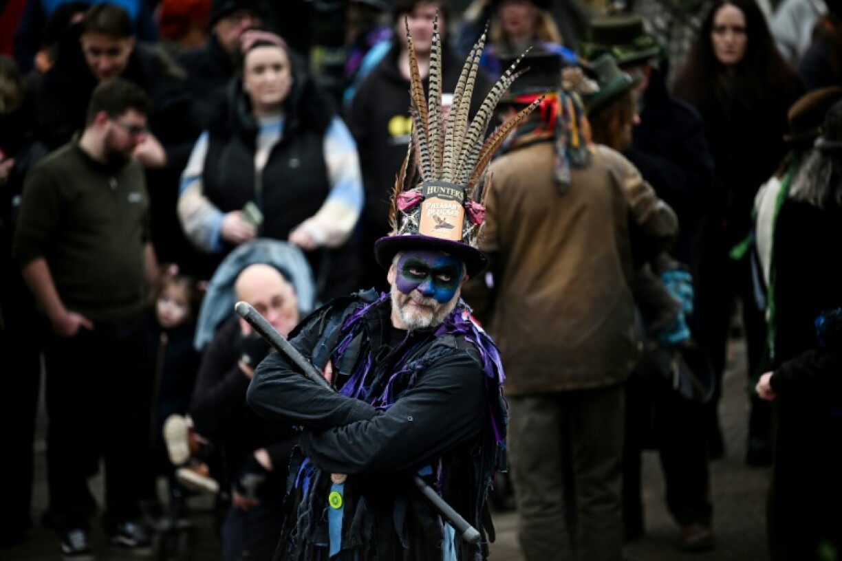 A Morris dancer looks on as he performs during the traditional wassail ceremony