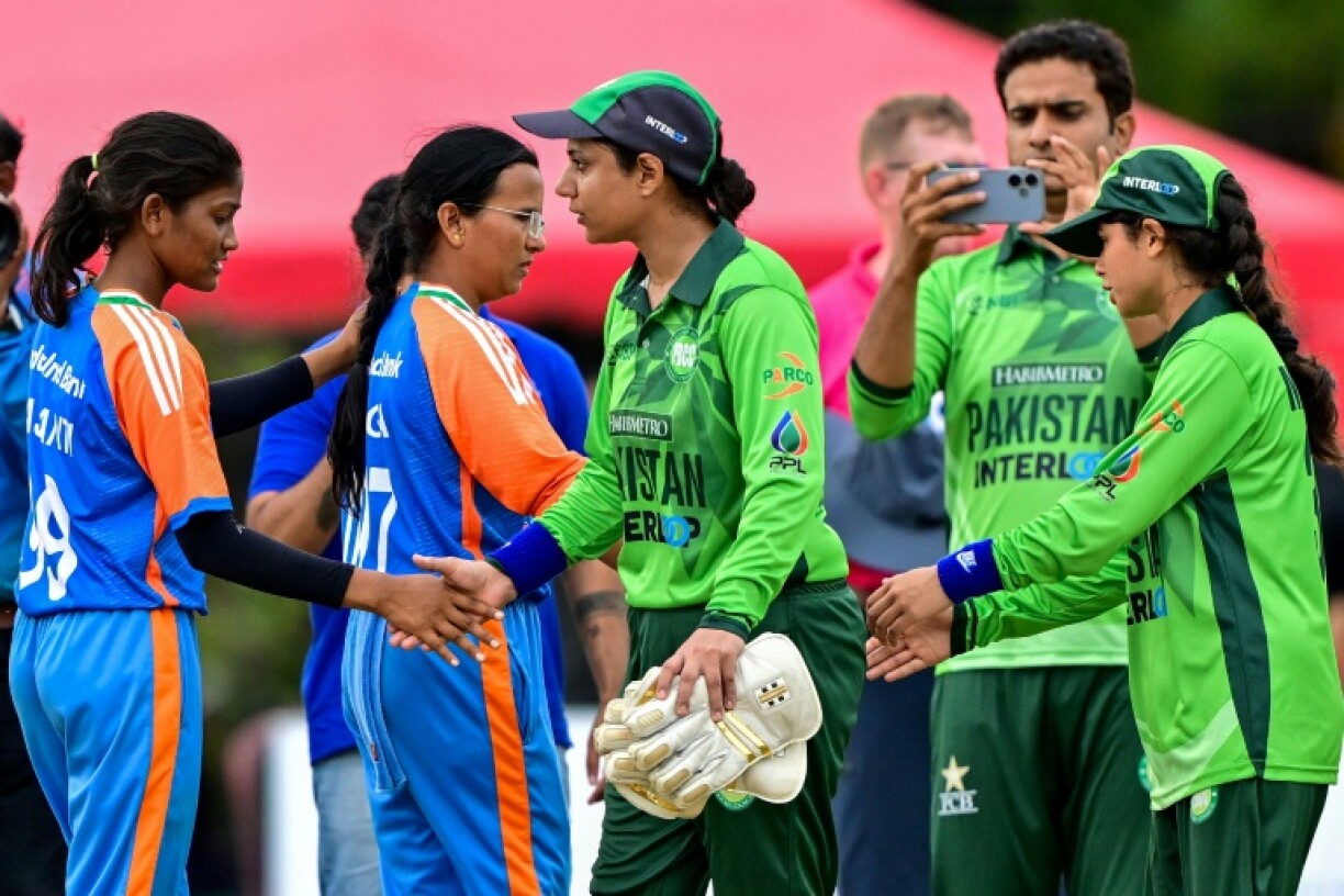 Pakistan players (R) shake hands with the Indians at the end of the Women’s Blind Twenty20 World Cup 2025 match in Katunayake, Sri Lanka on Sunday