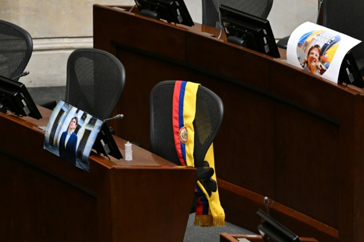 A picture of Colombian presidential candidate Miguel Uribe and his sash were displayed at his seat in Congress in Bogota following his death
