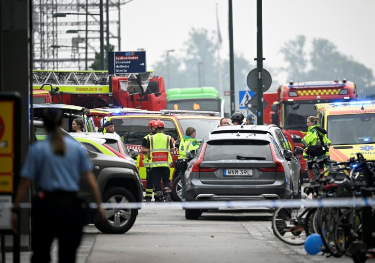 Police and rescue workers at the scene of a shooting in a shopping centre in Malmö, Sweden, 19 August 2022