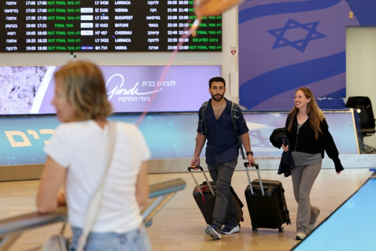 Travellers arrive at Israel's Ben Gurion airport as authorities gradually lift wartime restrictions