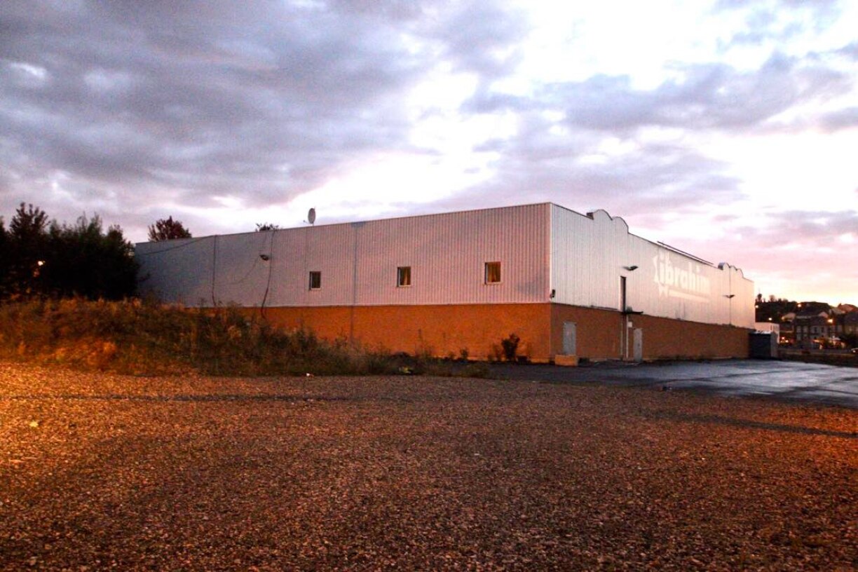 The dismembered body was discovered behind this former supermarket in Mont-Saint-Martin.