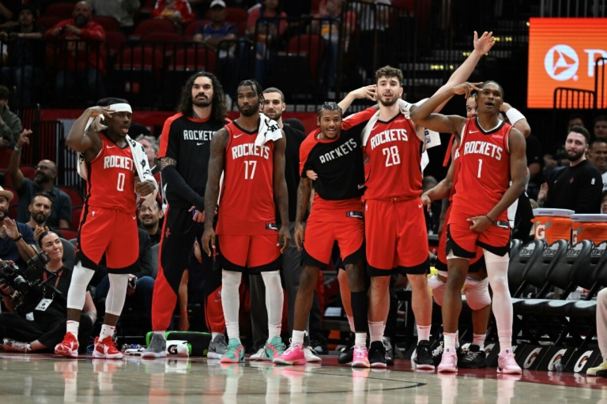 The Houston Rockets celebrate after beating the Utah Jazz to clinch an NBA playoff berth