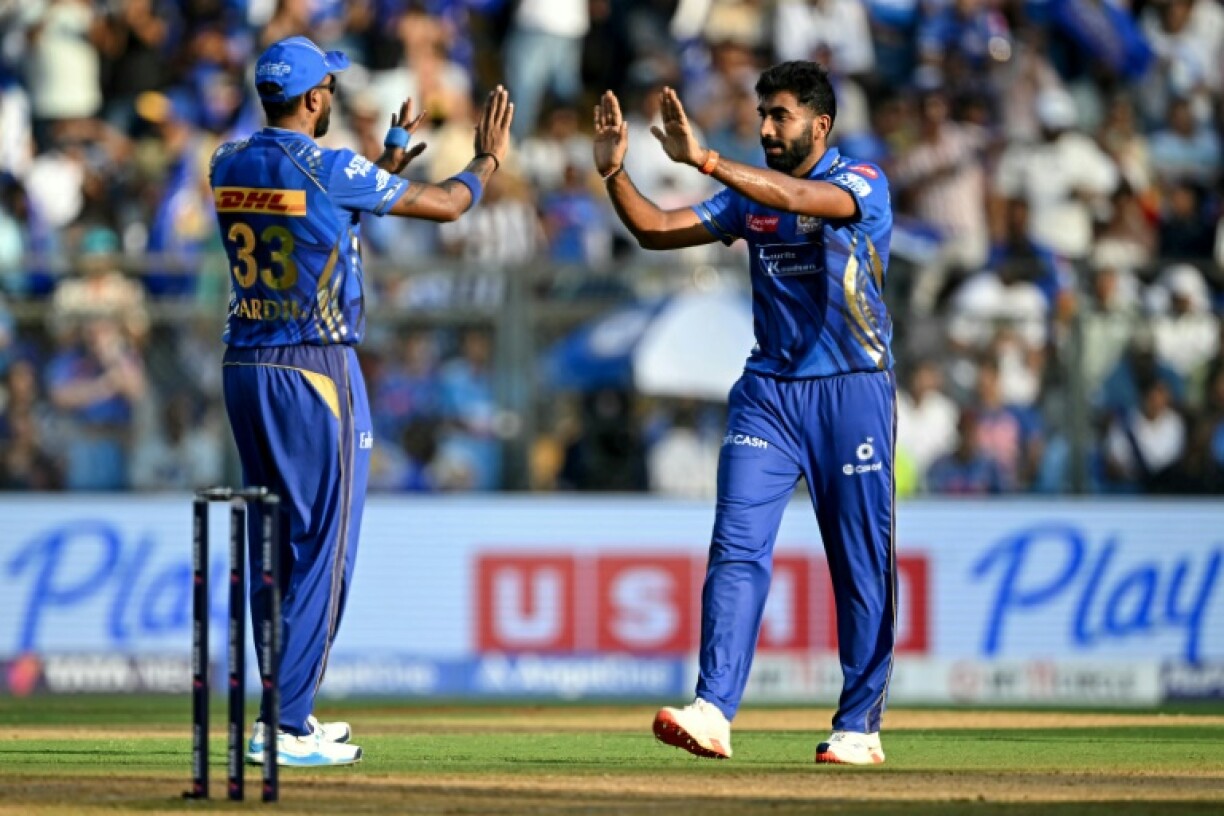 Jasprit Bumrah (R) celebrates with captain Hardik Pandya as Mumbai Indians beat Lucknow Super Giants in the Indian Premier League