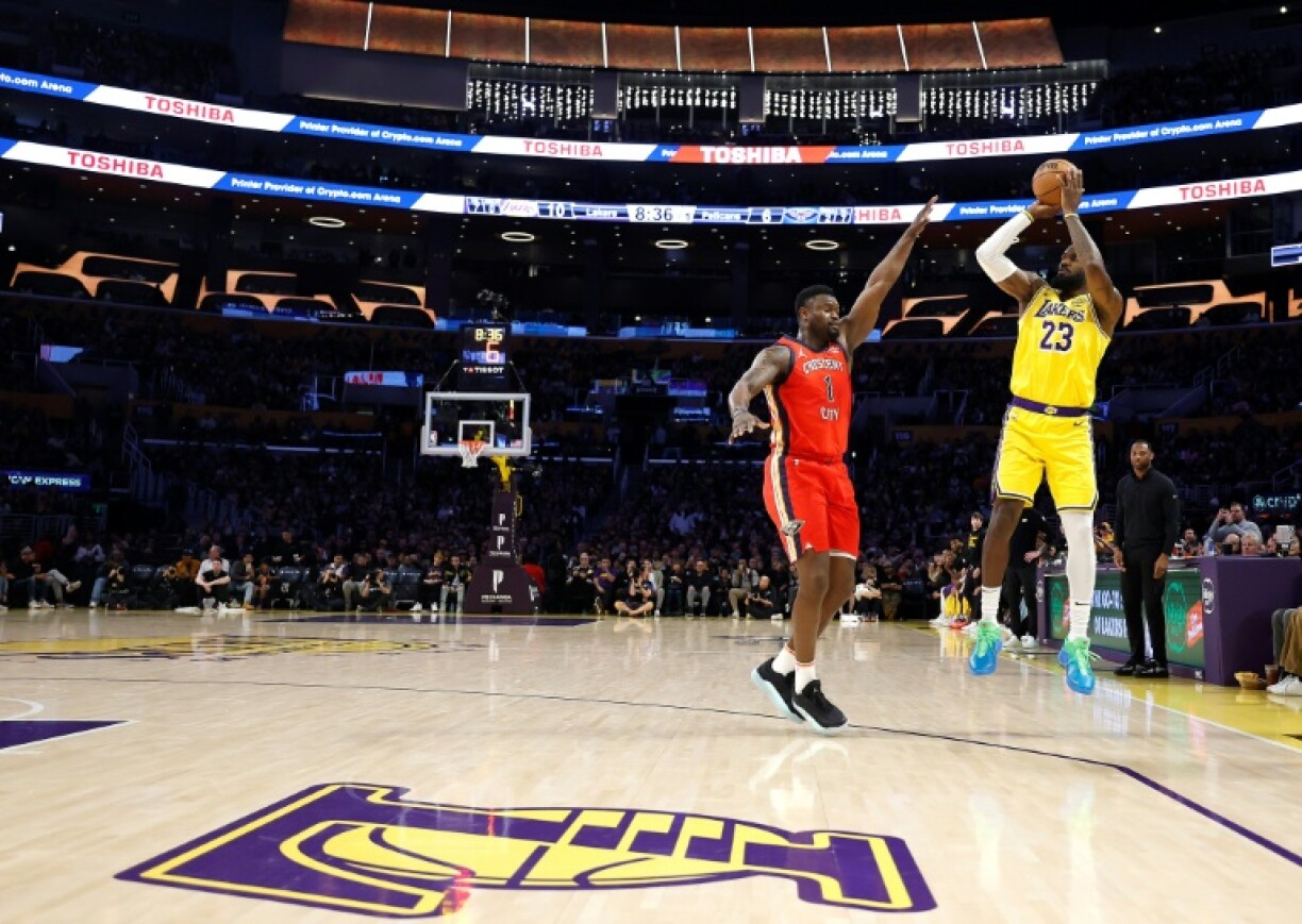 LeBron James drains a three-pointer to become the first NBA player in history to pass 50,000 career points