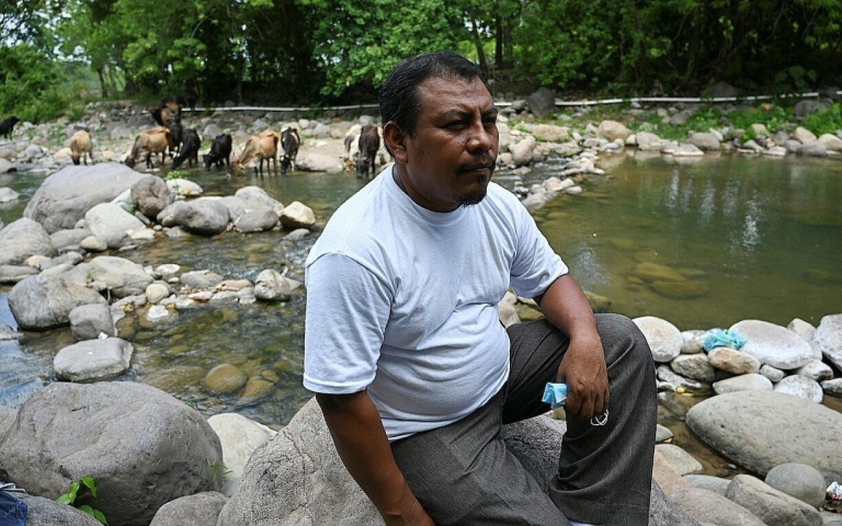 A judge in Honduras has ordered three men to stand trial for the murder of Honduran environmentalist Juan Lopez, seen here in 2021 as he watched the Guapinol river in Honduras