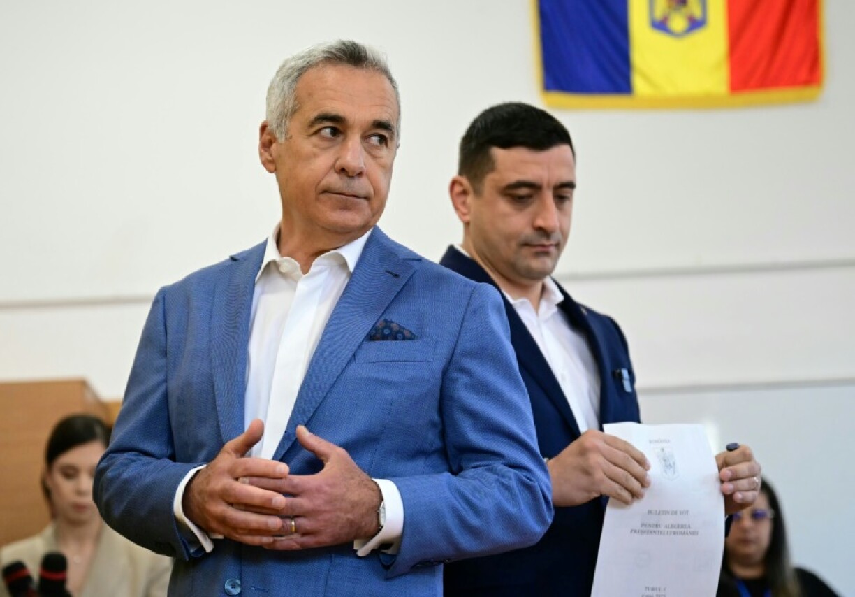 imion cast his ballot alongside now-barred candidate Calin Georgescu