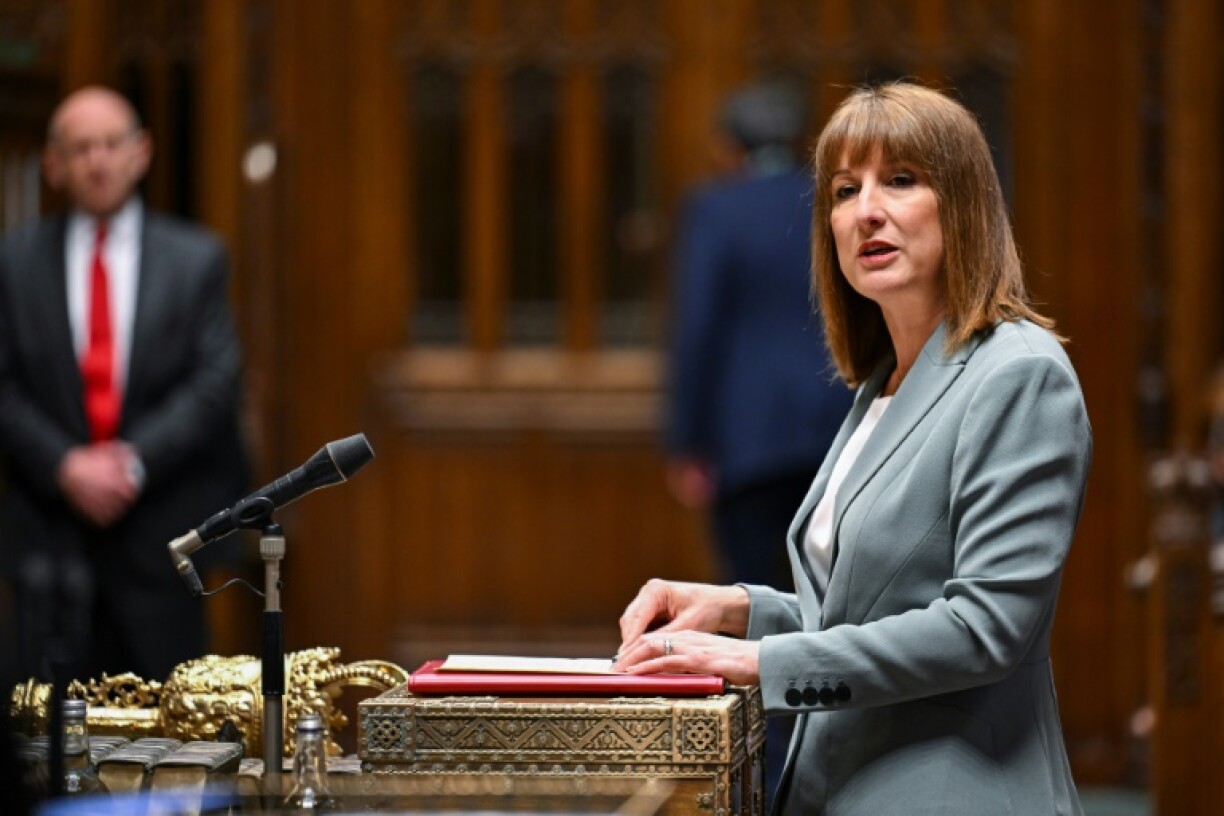 A handout photograph released by the UK Parliament shows Britain's Chancellor of the Exchequer Rachel Reeves presenting her Spending Review to members of Parliament