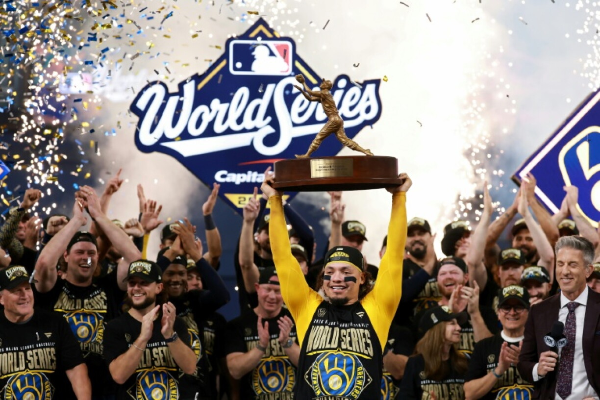 William Contreras of the Milwaukee Brewers poses with the Willie Mays World Series Most Valuable Player award after the Brewers' title-clinching win over the Tampa Bay Rays