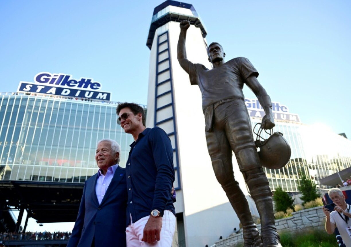 New England Patriots owner Robert Kraft and legendary Pats quarterback Tom Brady pose at the unveiling of a statue honoring Brady at the team's stadium