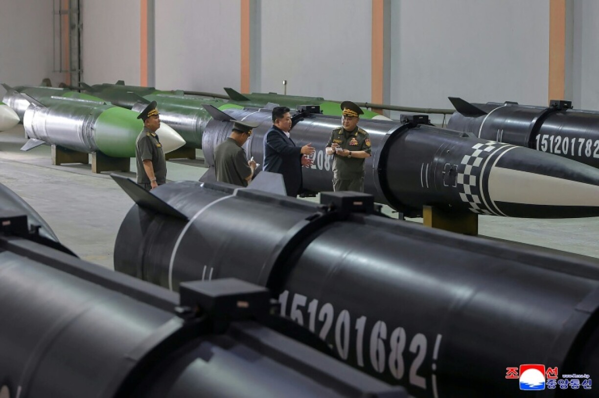 This picture taken on August 31 and released by North Korea's official Korean Central News Agency shows Kim Jong Un inspecting a missile production process at an undisclosed location in North Korea