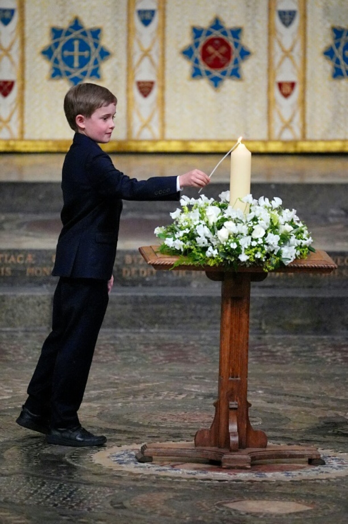 The great-great- grandson of war-time leader Winston Churchill, 10-year-old Alexander Churchill, lights the VE Day 80th Candle of Peace at Westminster Abbey in London