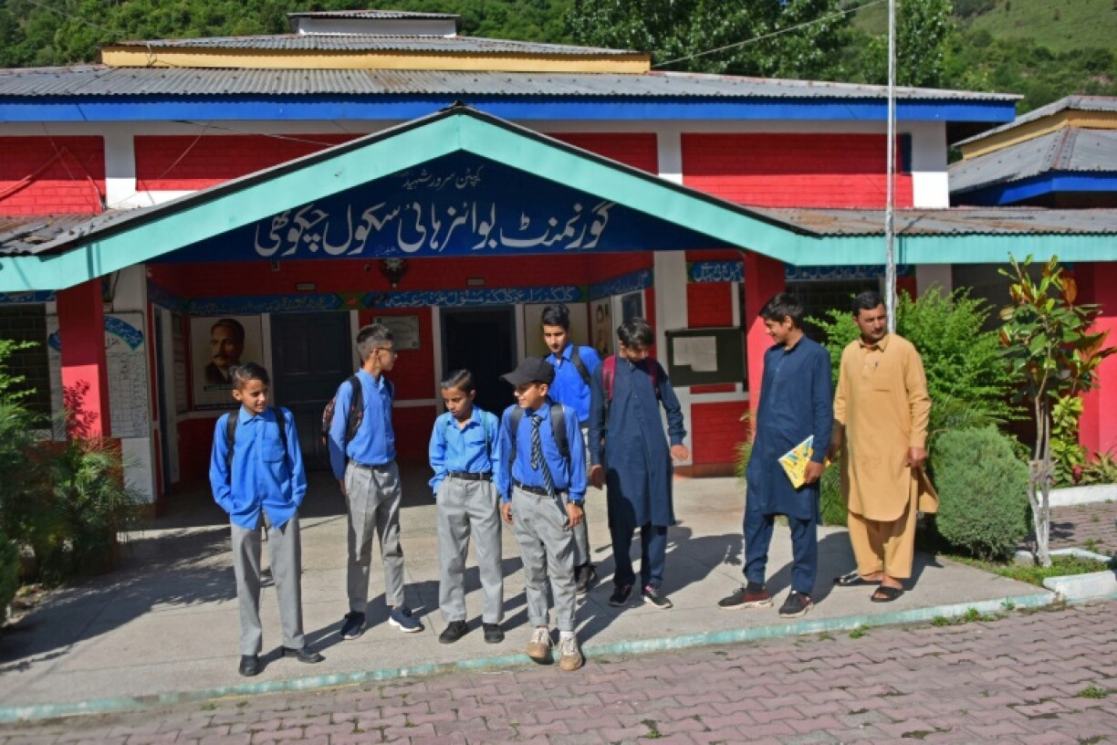 Students return to school in the frontier village of Chakothi near the Line of Control in Pakistan-administered Kashmir