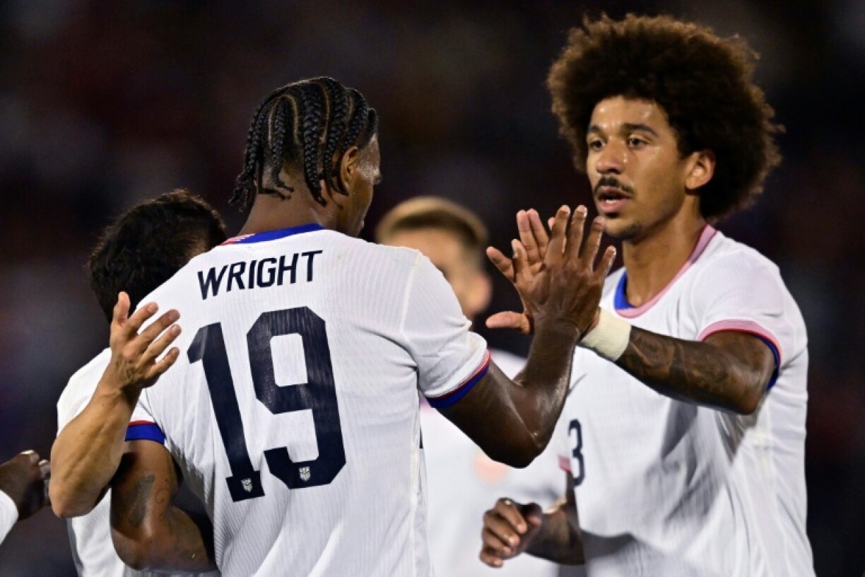 Haji Wright of the United States celebrates with teammates after scoring his first of two goals in a 2-1 victory over Australia in an international football friendly