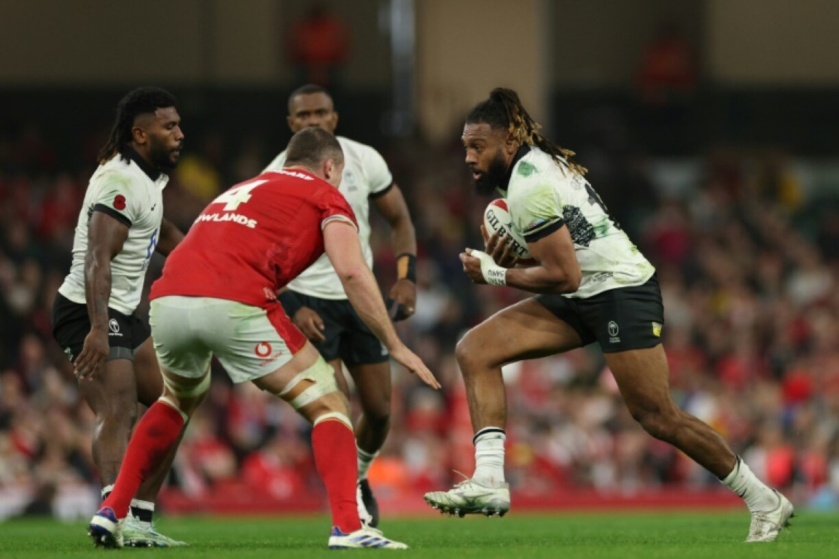 Running back: Fiji centre Waisea Nayacalevu (R), pictured in action against Wales in November, is joining Welsh regional side the Ospreys