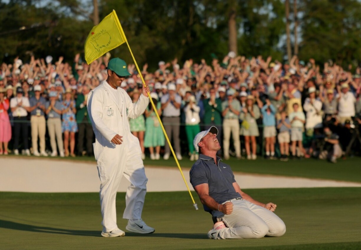 Rory McIlroy (centre) won the Masters to complete the career grand slam