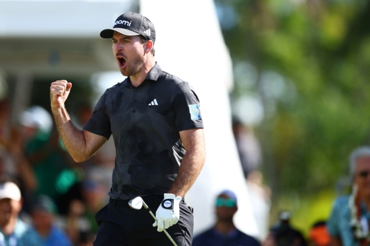 Canada's Nick Taylor reacts after chipping in for an eagle from 60 feet on the 18th green during the final round on his way to victory at the PGA Sony Open in Hawaii