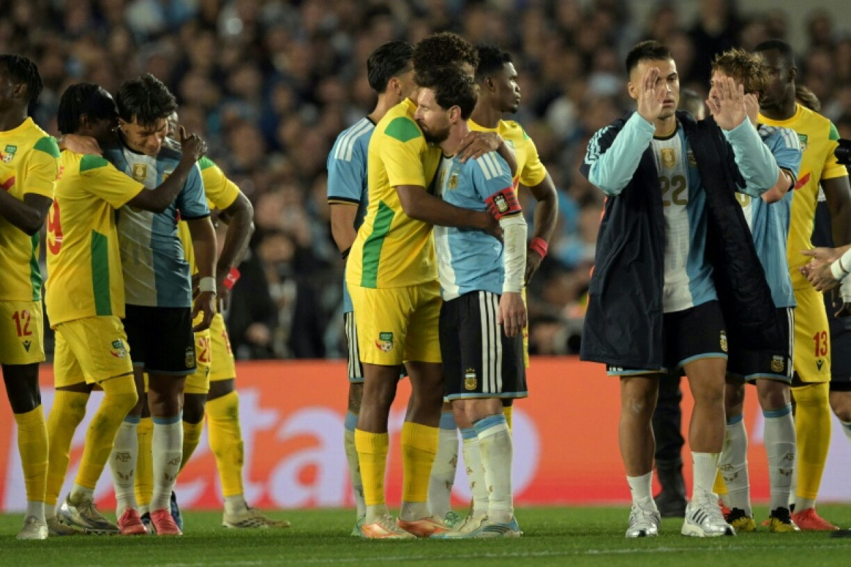 Lionel Messi embraces Benin defender Liam Omore at the end of the international friendly football match between Argentina and Benin