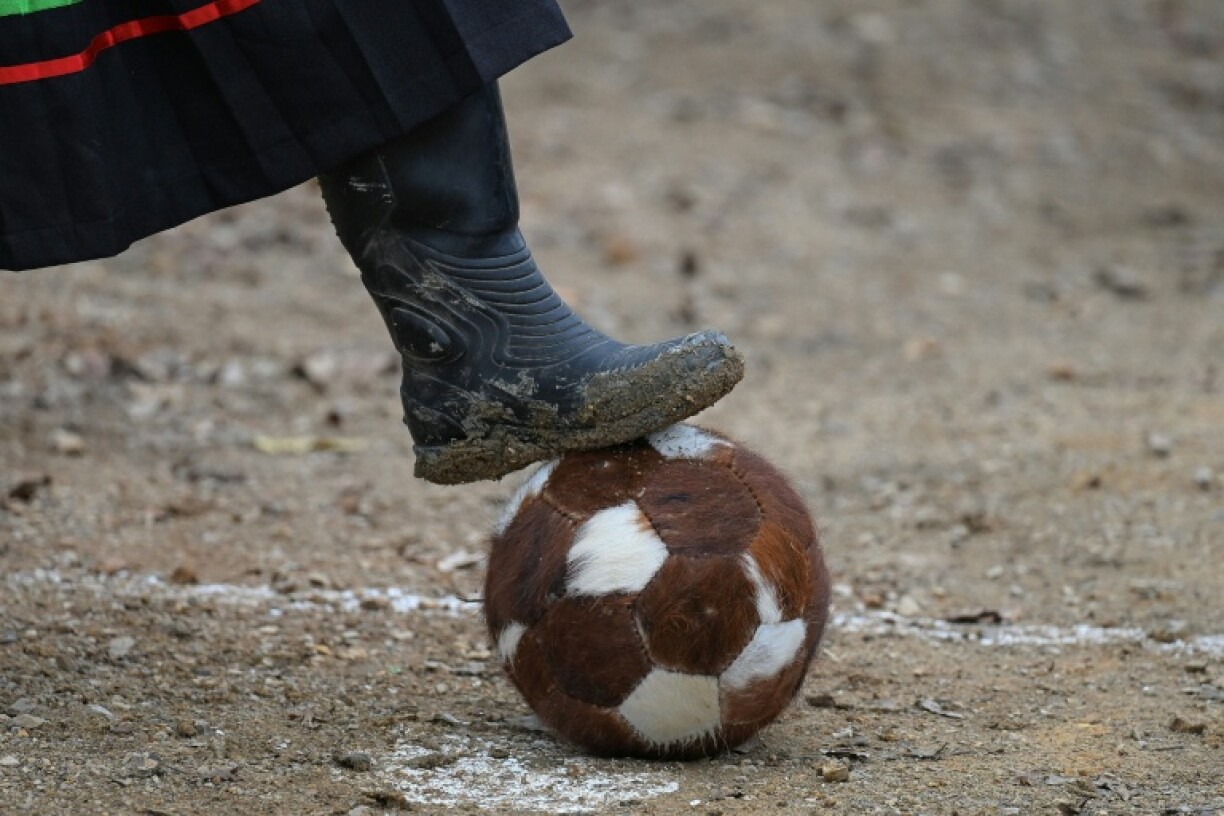 The tournament's official ball is covered with cowhide and hair and the pitch is a scrubby expanse of dirt and stones