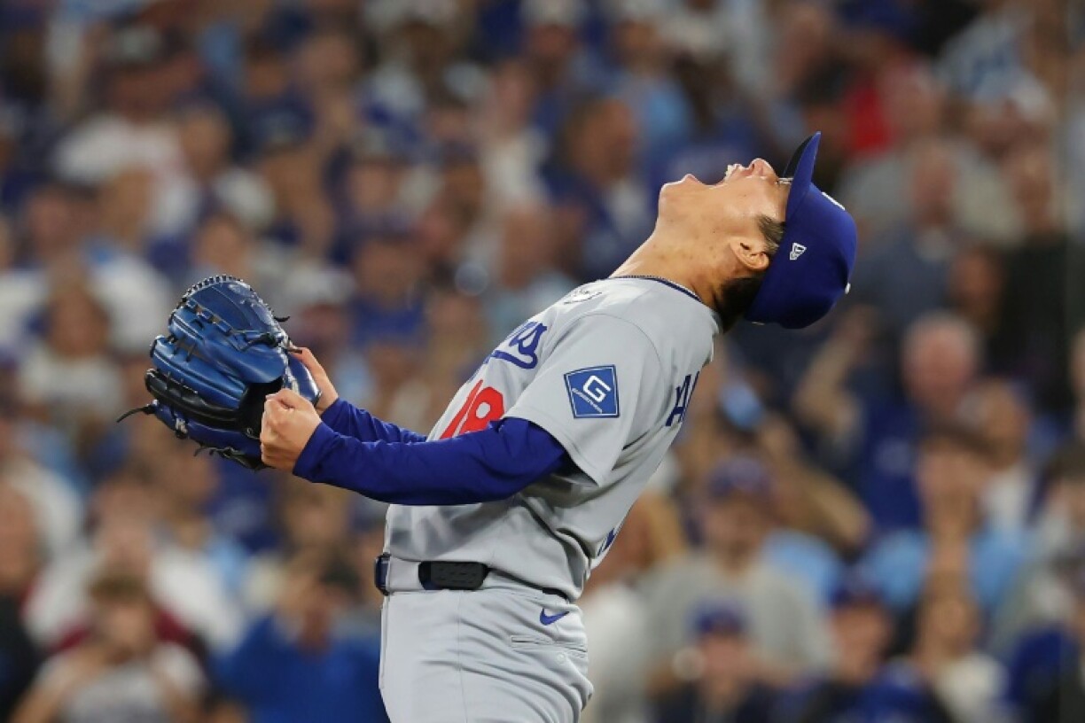Yoshinobu Yamamoto celebrates after the Los Angeles Dodgers clinch World Series victory over the Toronto Blue Jays
