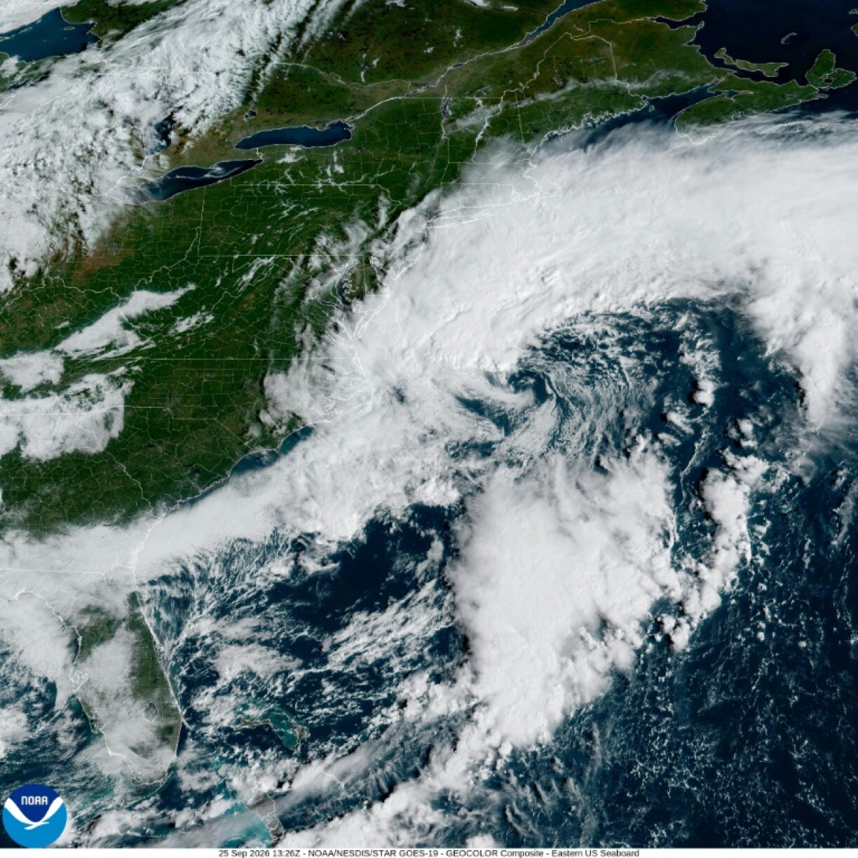A handout satellite image shows a storm system over the Atlantic Ocean along the east coast of the United States and Canada