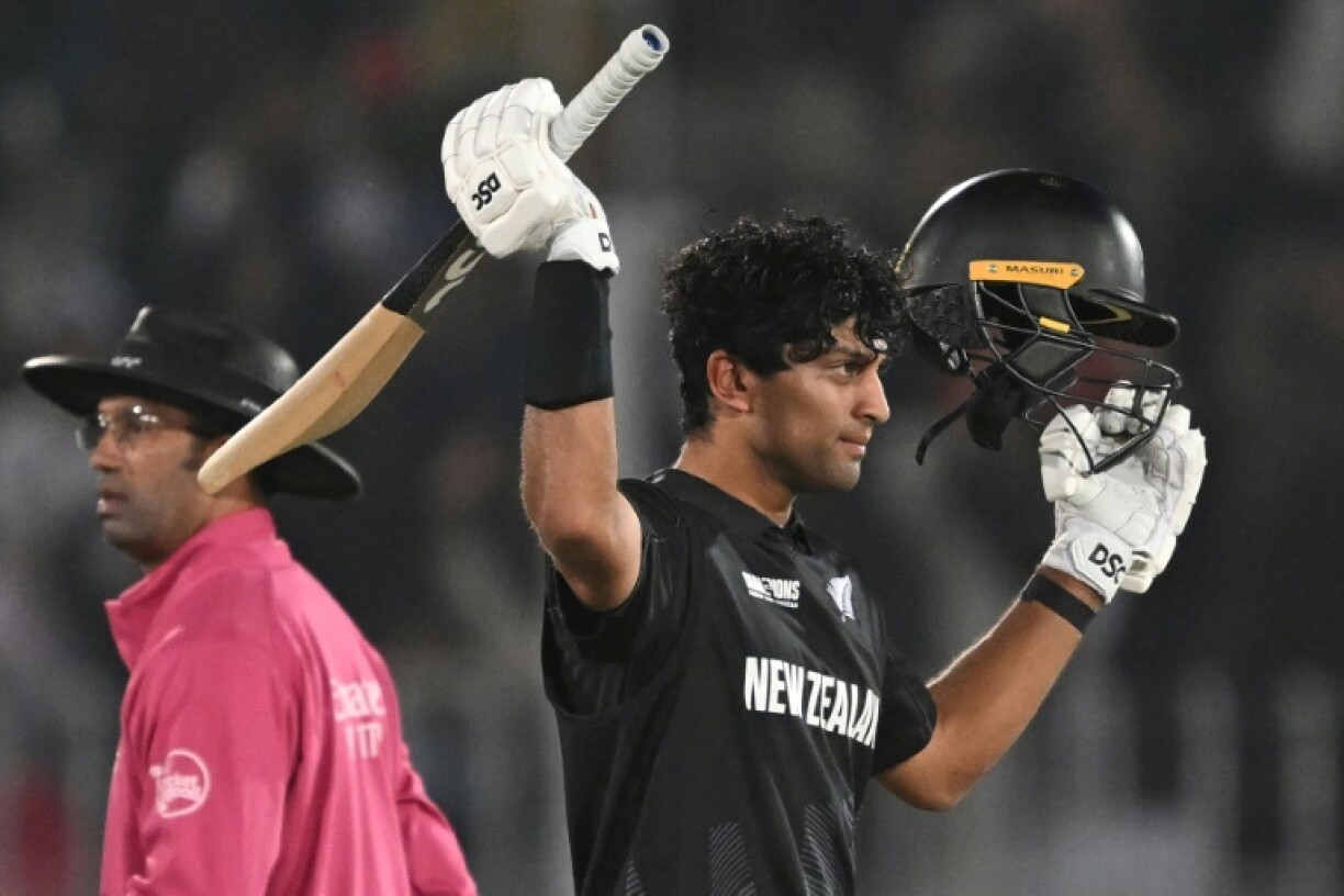 New Zealand’s Rachin Ravindra celebrates after reaching his century against Bangladesh