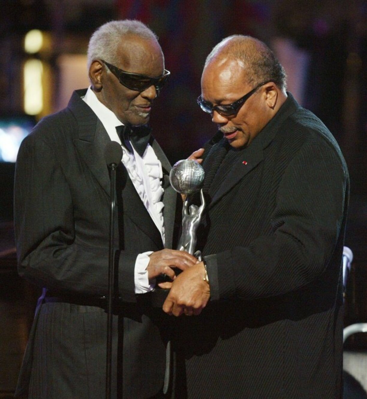 Ray Charles (L) and Quincy Jones -- seen here at the 35th Annual NAACP Image Awards in 2004 in Hollywood -- were teenagers when they first met / © Getty Images North America/Getty Images/AFP/File