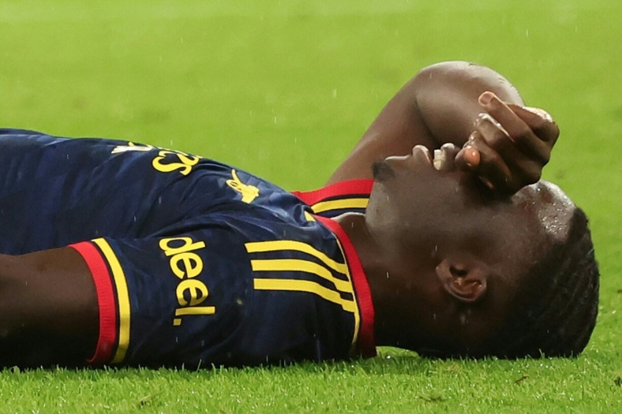 Arsenal's Bukayo Saka covers his face after his injury against Bayern Munich on Wednesday