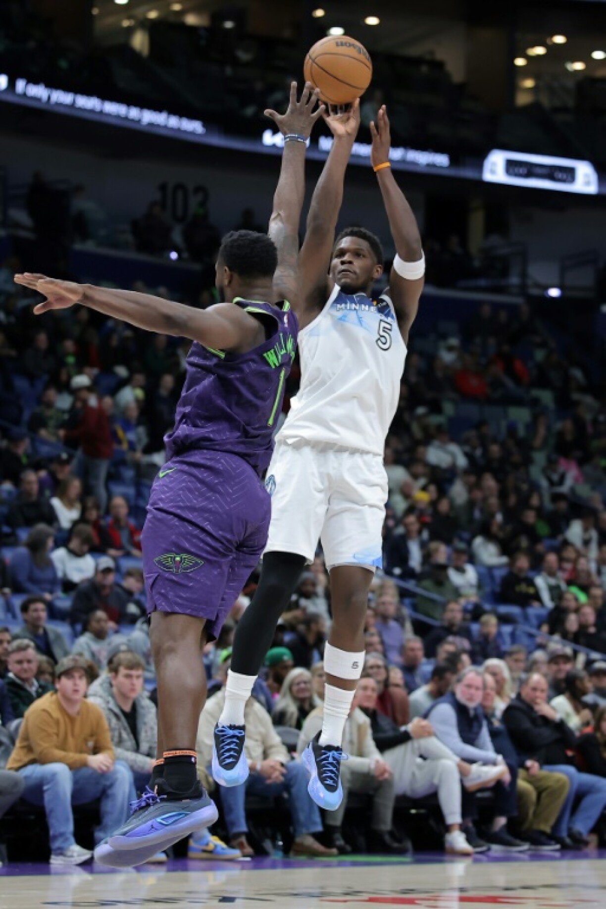 Anthony Edwards of the Minnesota Timberwolves shoots over New Orleans' Zion Williamson in the Timberwolves' NBA victory over the Pelicans