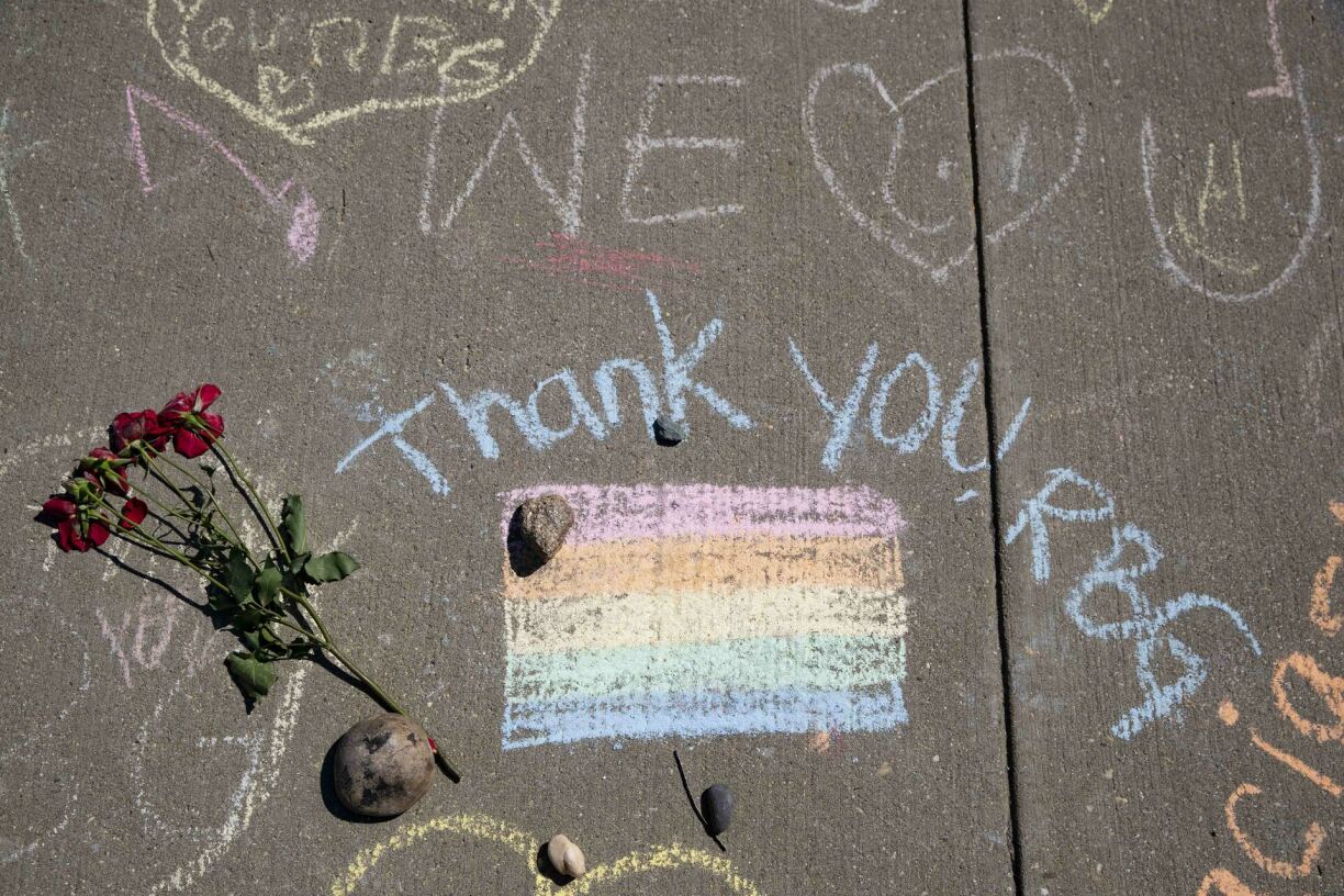 Chalk messages, flowers, and memorial stones, are seen at a makeshift memorial for late Supreme Court Justice Ruth Bader Ginsburg on the steps of the United States Supreme Court on September 20, 2020 in Washington, DC.