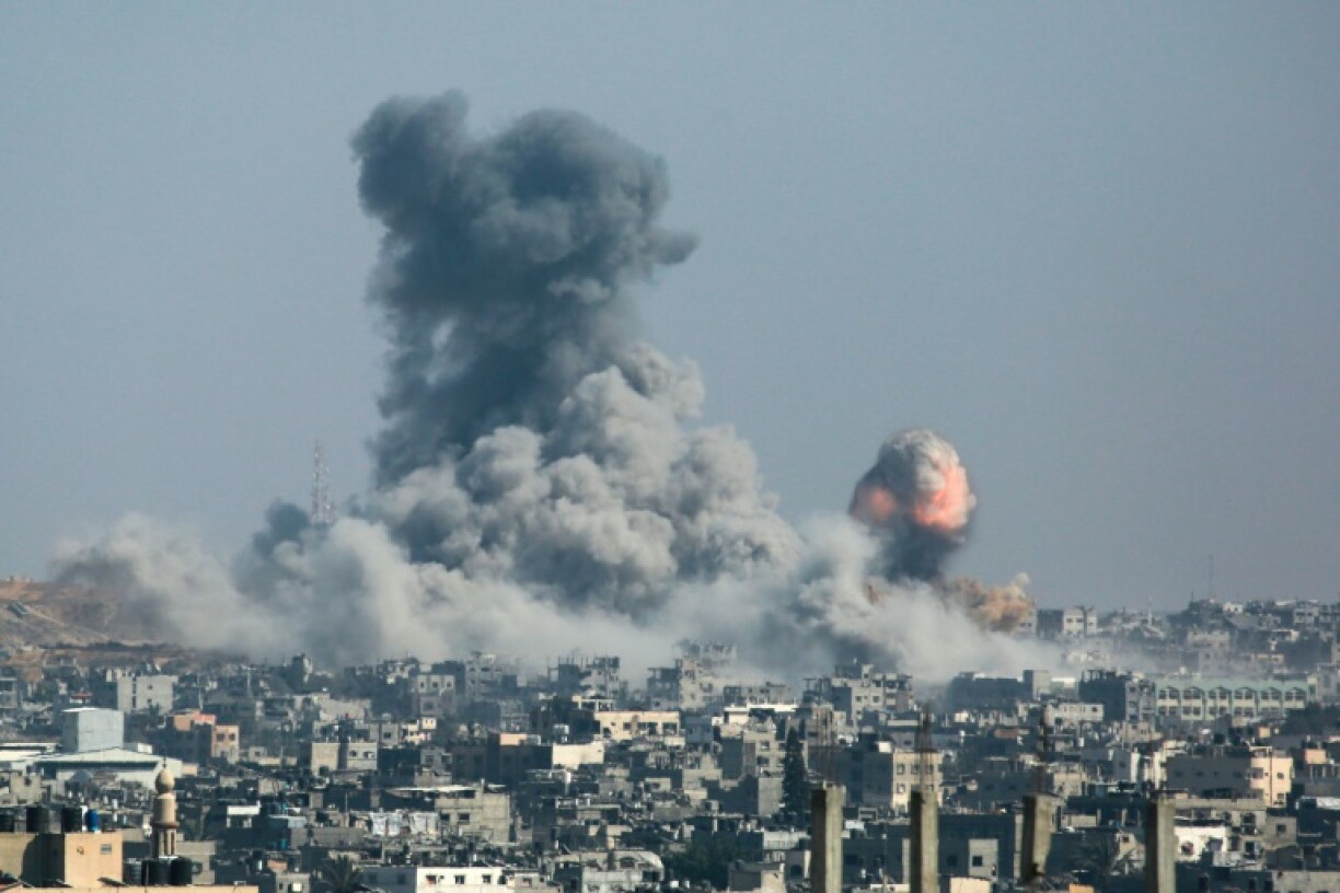 A column of fire and smoke erupts following Israeli bombardment of areas in eastern Gaza City