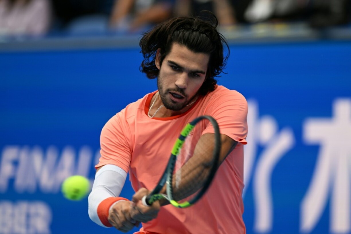 Spain's Carlos Alcaraz hits a return against Italy's Matteo Arnaldi during their men's singles tennis match at the ATP Tour Japan Open Tennis Championships at the Ariake Tennis Forest Park in Tokyo on October 3, 2026.