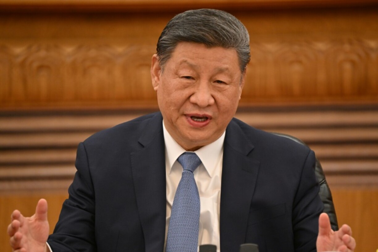 China’s President Xi Jinping speaks during a meeting with a group of foreign executives at the Great Hall of the People in Beijing on March 28, 2025.