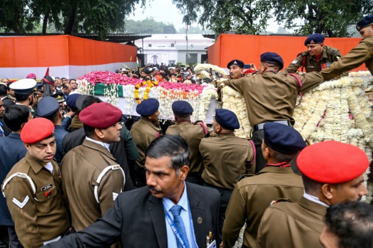 Officers carry Singh's coffin for the state funeral ceremony in New Delhi