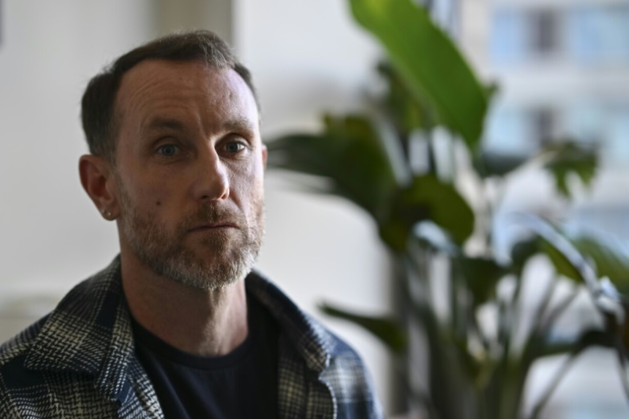 Joseph Lynskey, who survived being pushed onto subway tracks in front of an oncoming train on December 31, 2024, sits during an interview with AFP in New York City