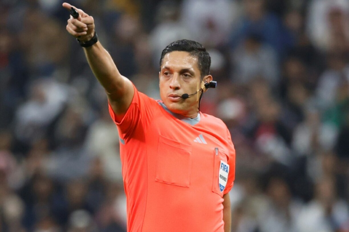 Venezuelan referee Jesus Valenzuela wearing the 'Ref Cam' during the 2024 FIFA Intercontinental Cup final football match between Spain's Real Madrid and Mexico's Pachuca at the Lusail Stadium in Doha on December 18, 2024.